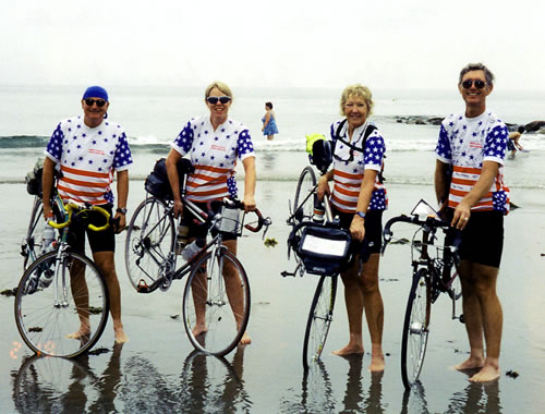 Gunnel and group dripping front tire in Atlantic Ocean.