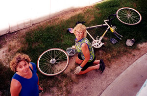 Gunnel cleaning her bike.  Friend Fran on left side.