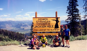 Group in front of Jackson Hole town sign.