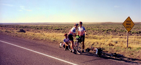 Group in high wind area on boring stretch of pavement in Wyoming.